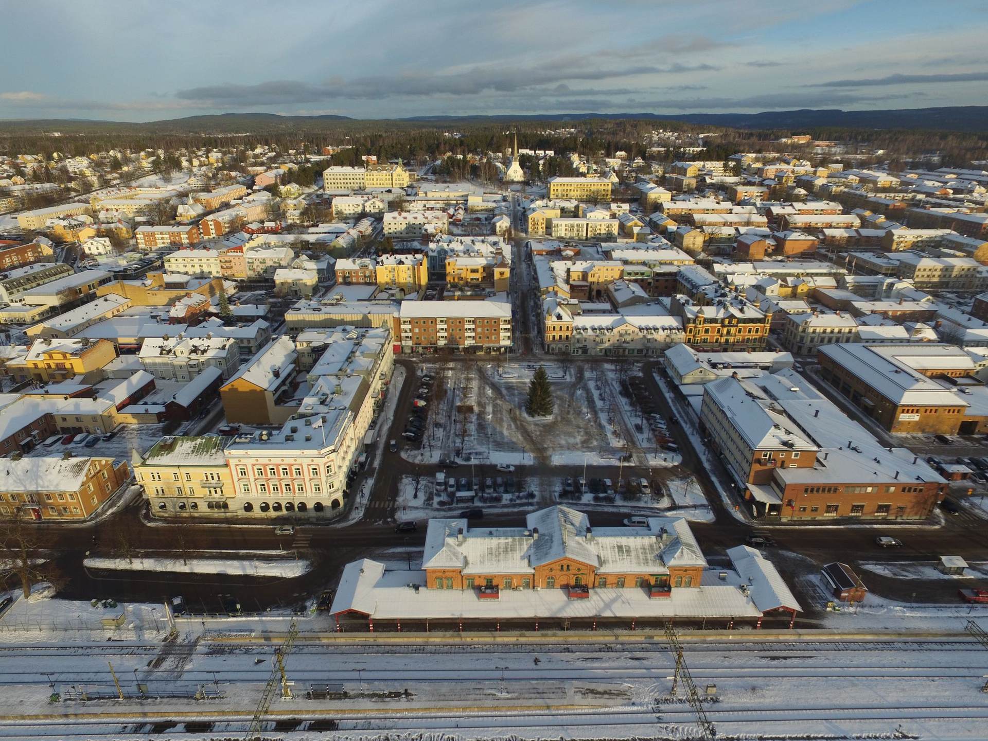 Aerial view over the centre of Arvika in winter light, with forest on the horizon